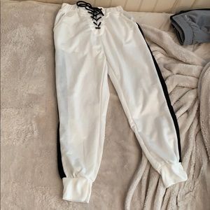 white joggers with black strip on both sides